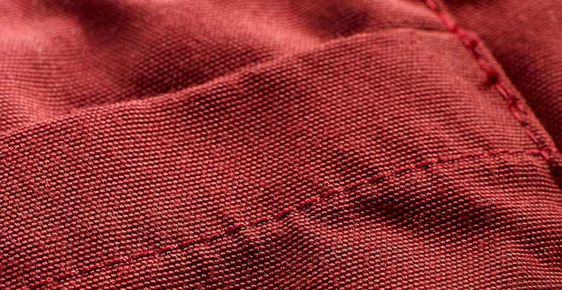 Closeup of stitching on polyester fabric