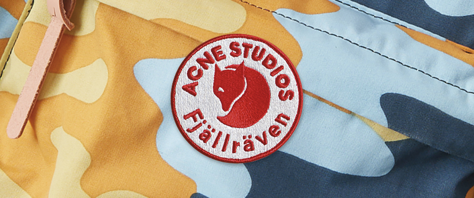 Closeup of Acne Studios and Fjallraven cobranded logo