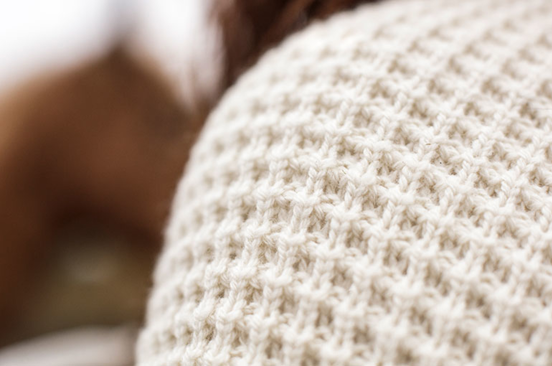 Closeup of knit white sweater